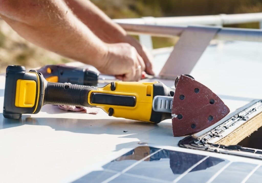 Close-up of cracked RV roof seam before resealing service