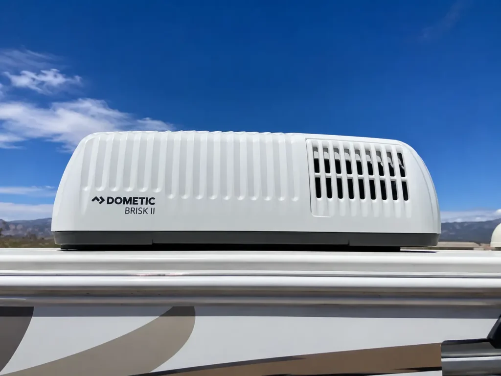 Dometic Brisk II rooftop air conditioner unit on RV against vivid blue New Mexico sky Albuquerque AC repair service